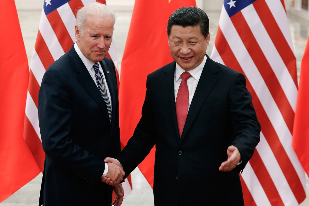 Chinese President Xi Jinping shakes hands with Joe Biden in Beijing when he was US vice-president in 2013. Observers say the two leaders should hold “frequent summits” to improve ties. Photo: TNS