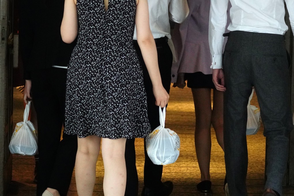 People holding takeaway meals in Admiralty in Hong Kong. When ordering, think about the time it will take getting from the restaurant kitchen to your table before you make your choice. Photo: Sam Tsang
