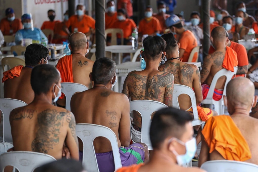 Inmates at the New Bilibid Prison wait for their turn to have their tattoo removed in Manila. Photo: AFP