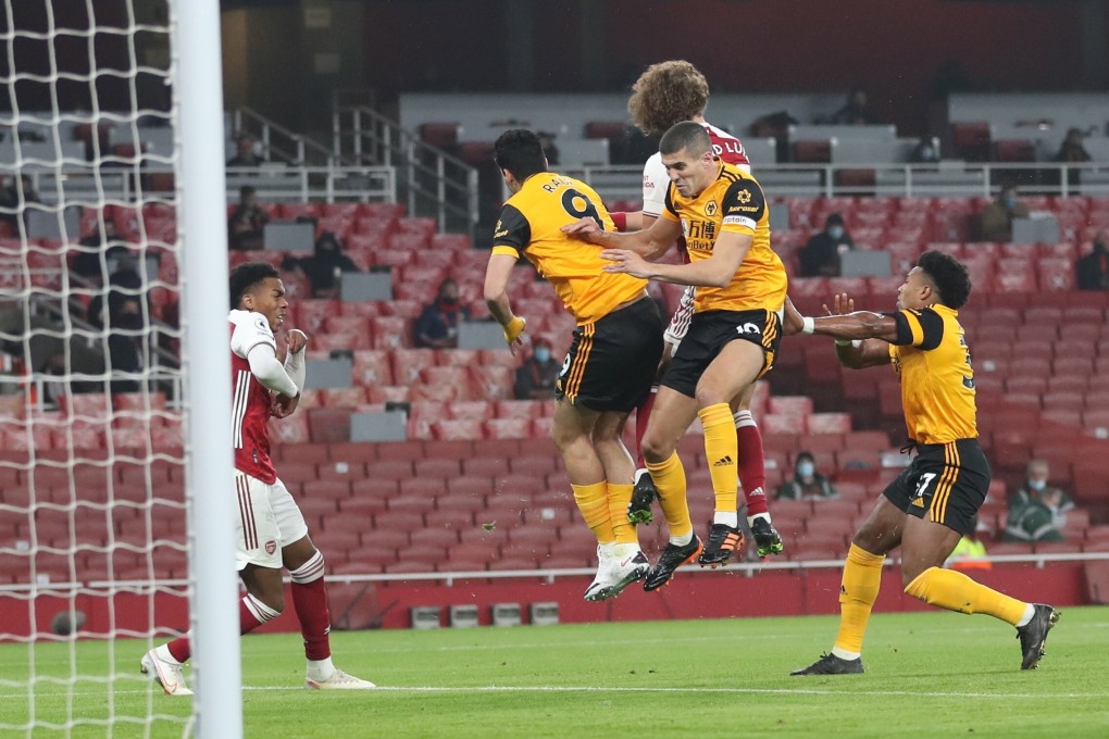 David Luiz and Raul Jimenez clash heads during a challenge. Photo: EPA