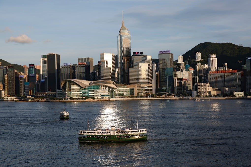 A Star Ferry crosses Victoria Harbour in Hong Kong in June. Hong Kong must try to retain investor favour in the midst of fast-developing mainland cities such as Shenzhen. Photo: Reuters