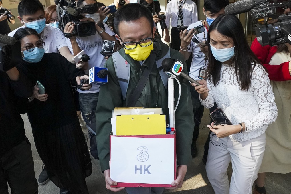 Senior news reporter Alex Sin Ching-fung (centre) leaves the i-Cable headquarters in Tsuen Wan after Tuesday’s sackings. Photo: Felix Wong