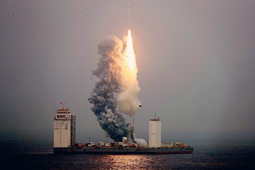 A Long March 11 carrier rocket takes off from a mobile launch platform in the Yellow Sea in June last year. Photo: Reuters