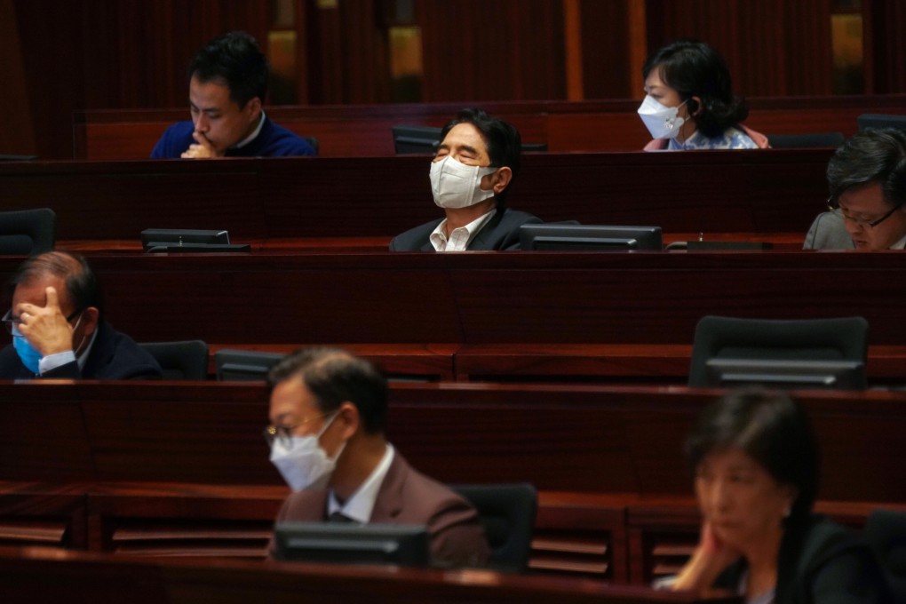 A lawmaker appears to be having trouble staying awake as Chief Executive Carrie Lam delivers her policy address at the Legislative Council in Admiralty, Hong Kong, on November 25. Photo: Reuters