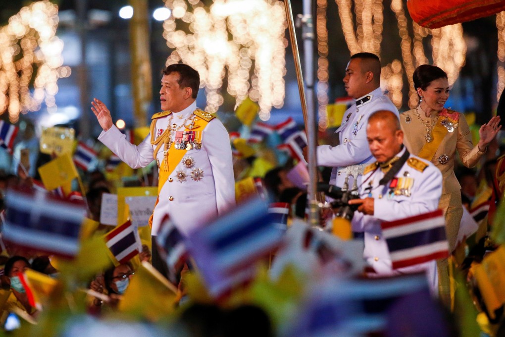 Thai King Maha Vajiralongkorn greets royalists ahead of a candlelight vigil to remember the birthday of his father. Photo: Reuters