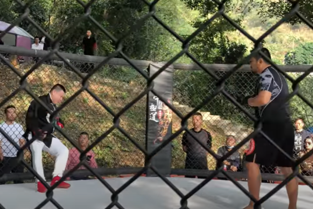 Chinese MMA fighter Xu Xiaodong (right) looks on at tai chi master Chen Yong after jabbing him in the face in their fight. Photo: YouTube