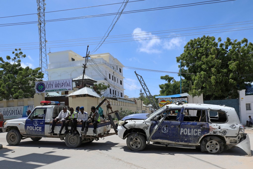 Somali police officers at the scene of a roadside explosion in Hodan district of Mogadishu, Somalia. Photo: Reuters