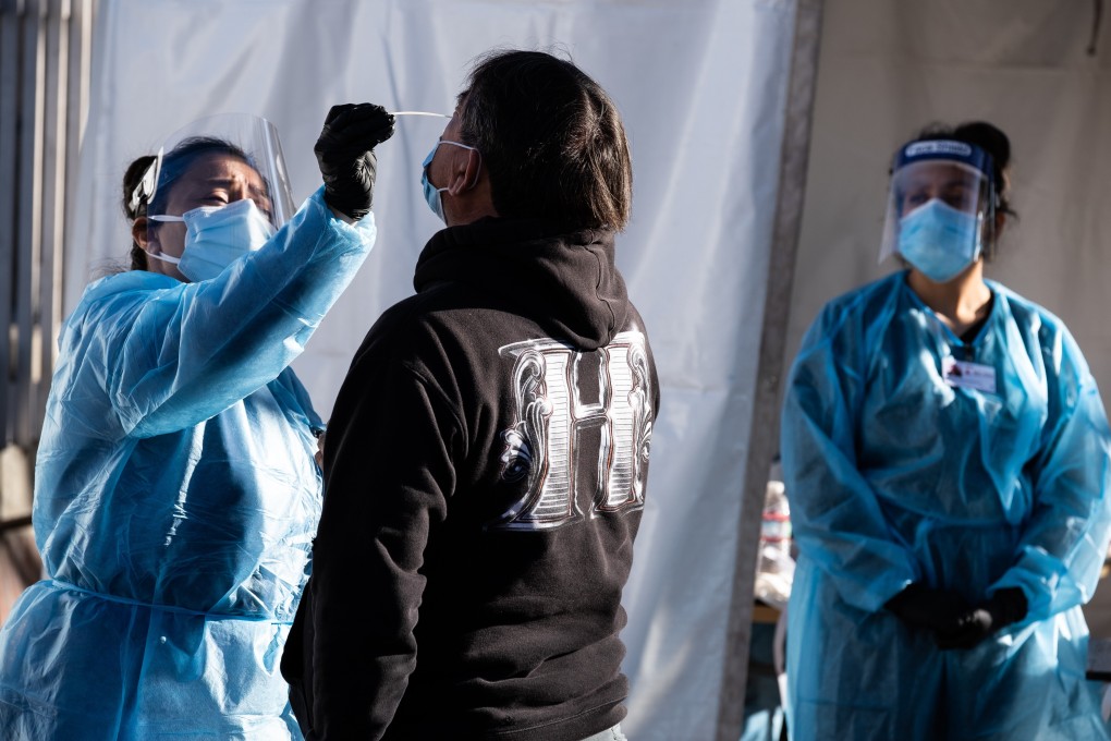 A health worker administers a test at a Covid-19 testing tent outside a Bay Area Rapid Transit station in the Mission district of San Francisco, California. Photo: Bloomberg