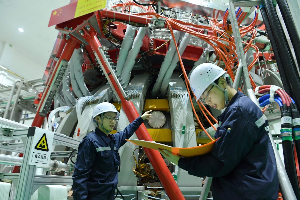 Technical personnel check China’s HL-2M nuclear fusion device at a research laboratory in Chengdu, Sichuan province on Friday. Photo: STR via AFP