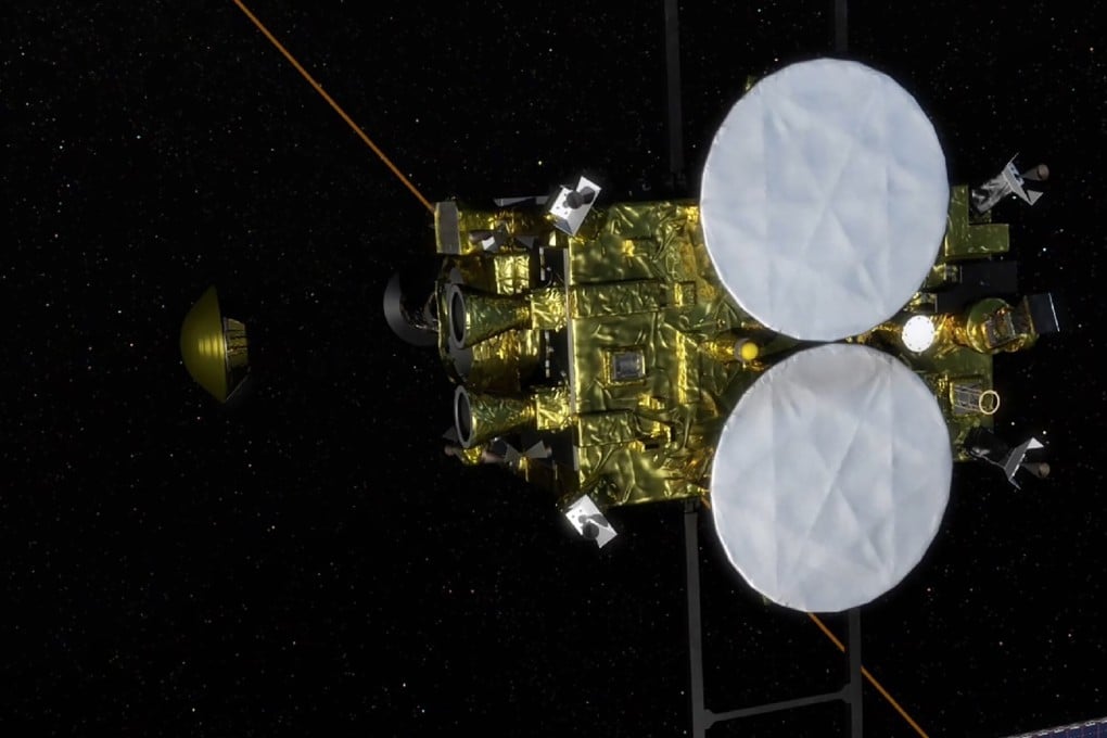 A computer-generated artist’s rendering of the separation of a capsule (centre left) containing samples collected from the asteroid Ryugu and scheduled for re-entry to Earth from the space probe Hayabusa2 (right). Photo: JAXA via Jiji Press/ AFP