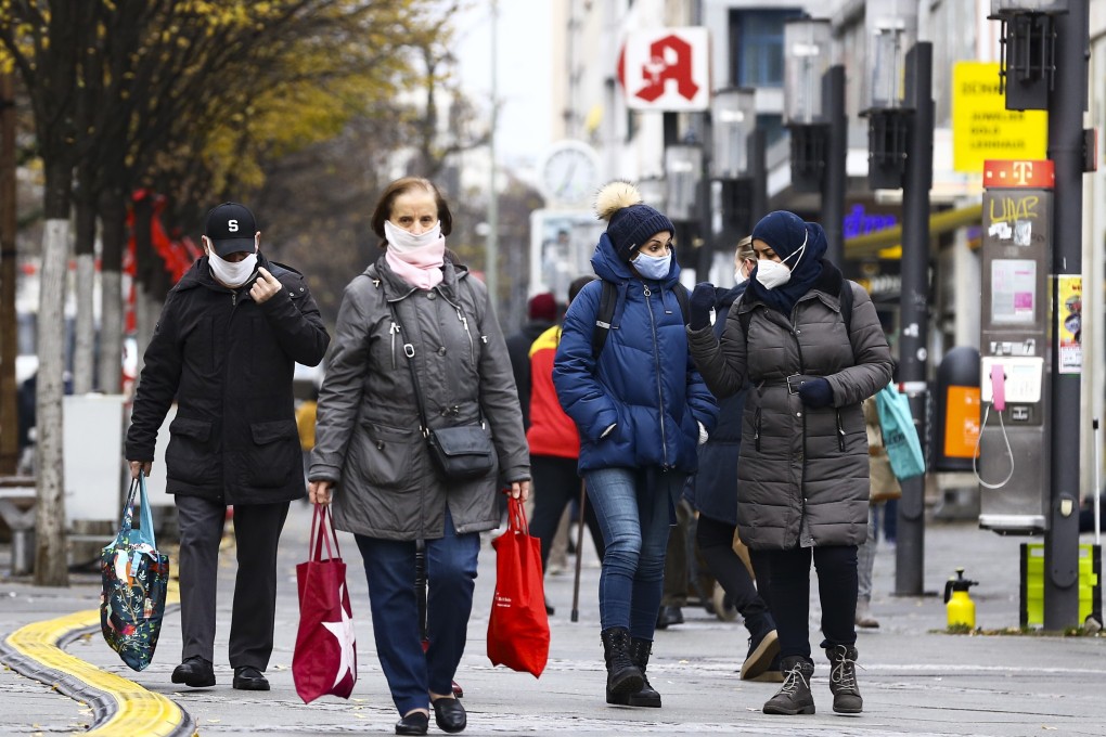 Masked shoppers on a street in Berlin. Photo: Getty Images