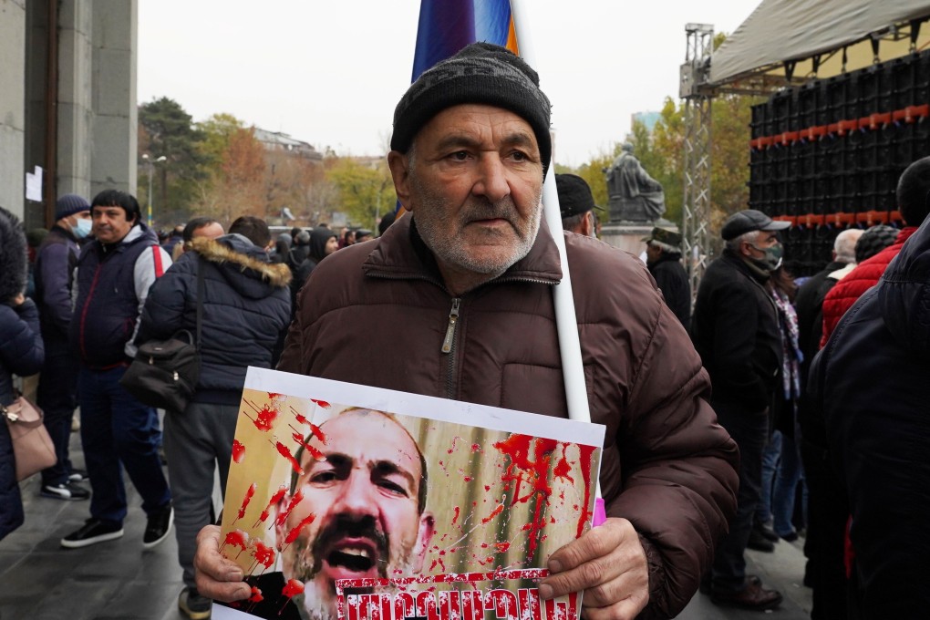 A man attends an opposition rally to demand the resignation of Armenian Prime Minister Nikol Pashinyan in Yerevan, Armenia on Saturday. Photo: Reuters