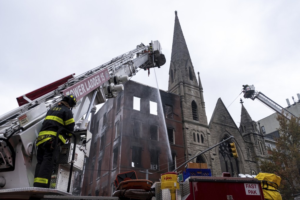 Firefighters work to extinguish the fire at Middle Collegiate Church on Saturday. Photo: AP