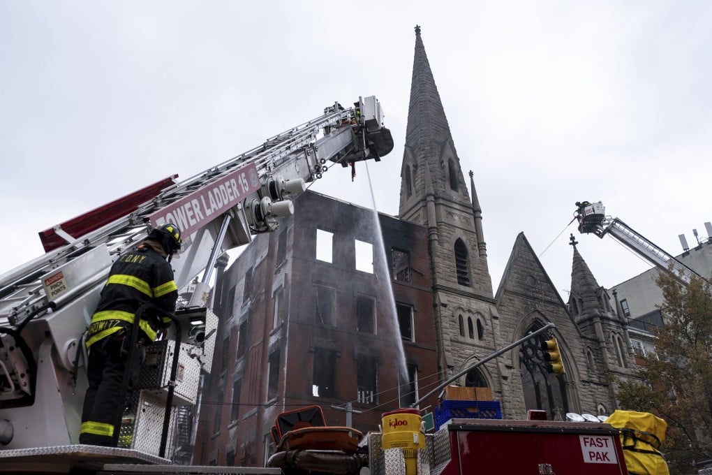 Firefighters work to extinguish the fire at Middle Collegiate Church on Saturday. Photo: AP