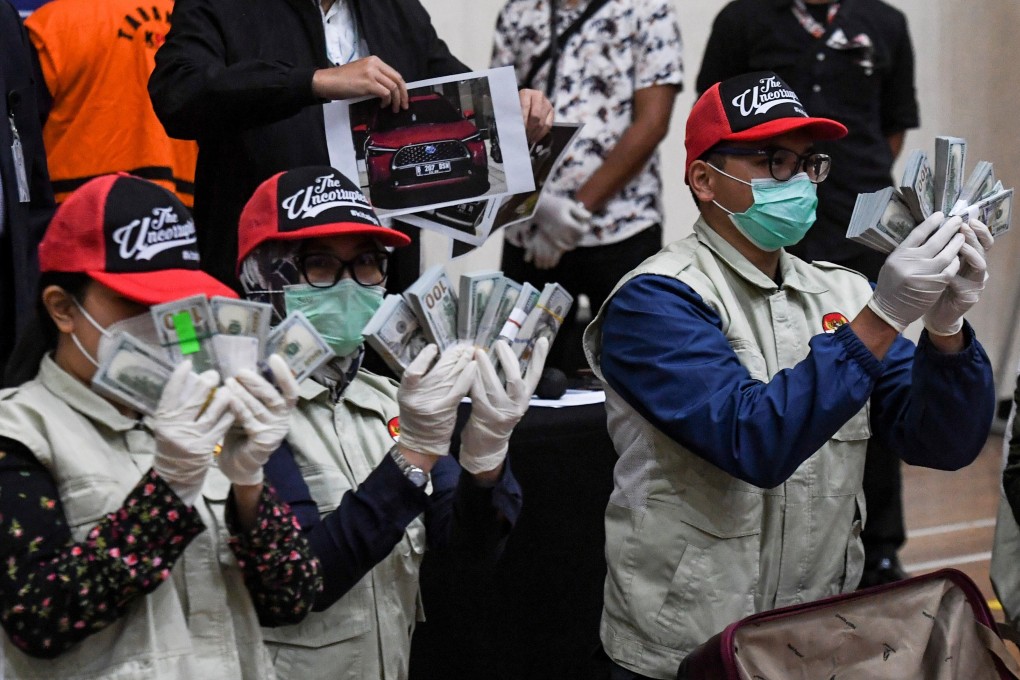 Indonesian anti-corruption officials show evidence of a bribery case related to Covid-19 social assistance, which named Indonesia's Social Affairs Minister Juliari Batubara as a suspect, during a press conference on Sunday. Photo: Reuters