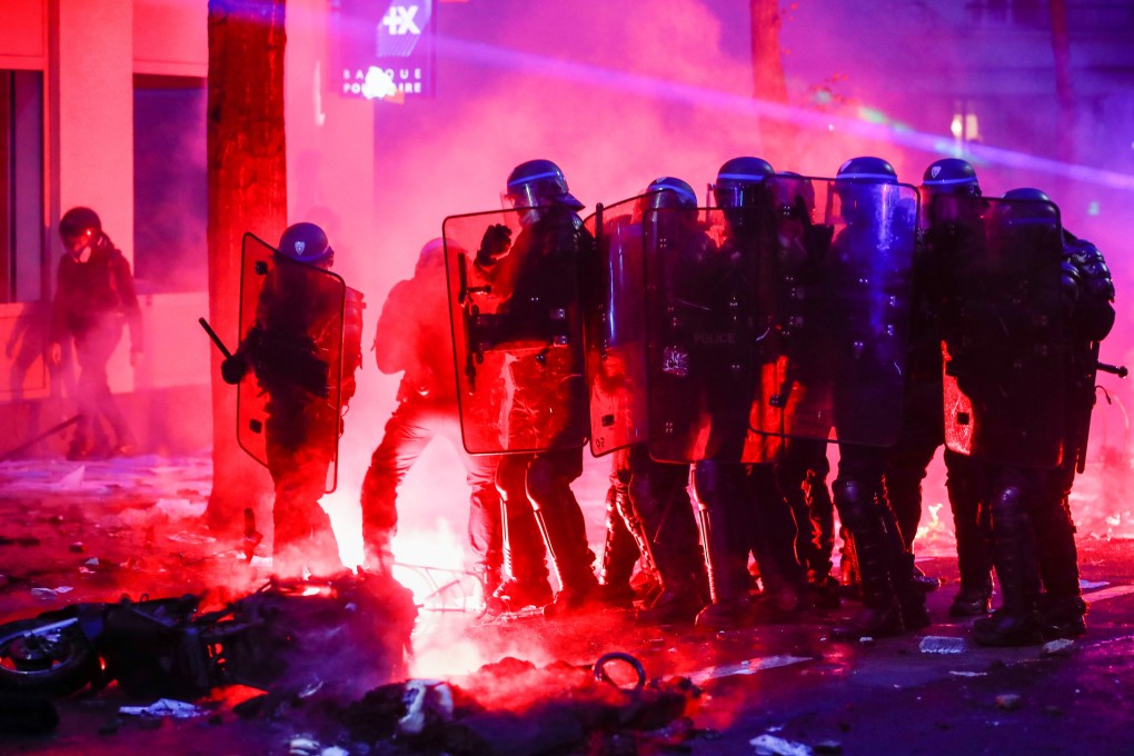 Police officers hold their shields during a protest against the Global Security Bill in Paris on Saturday. Photo: Reuters