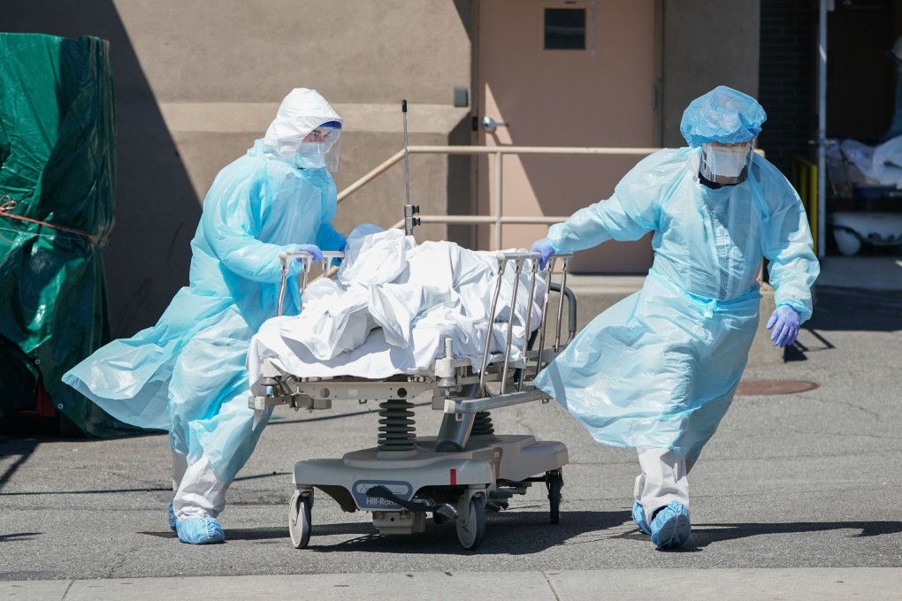 Bodies are moved to a refrigerated truck serving as a temporary morgue at a hospital in New York in April. Photo: AFP