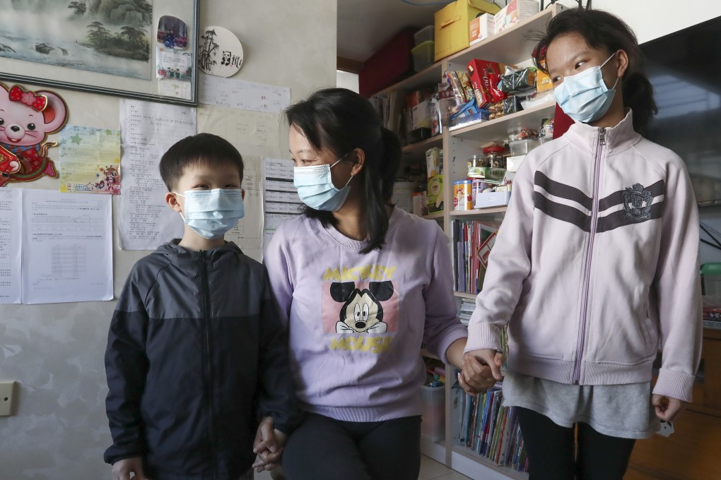Wong Shui-ying (centre) with her seven-year-old son Leung Yu-wang and 10-year-old daughter Leung Yee-tung at their home in Shek Kip Mei. Photo: Jonathan Wong