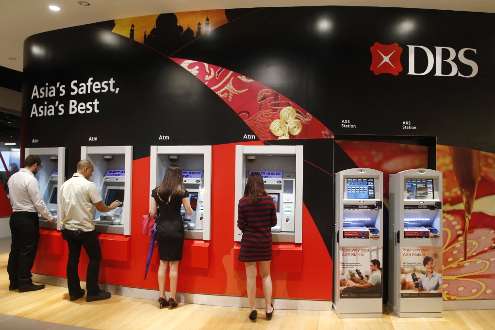 People access DBS cash withdrawal machines in Singapore. Photo: Reuters