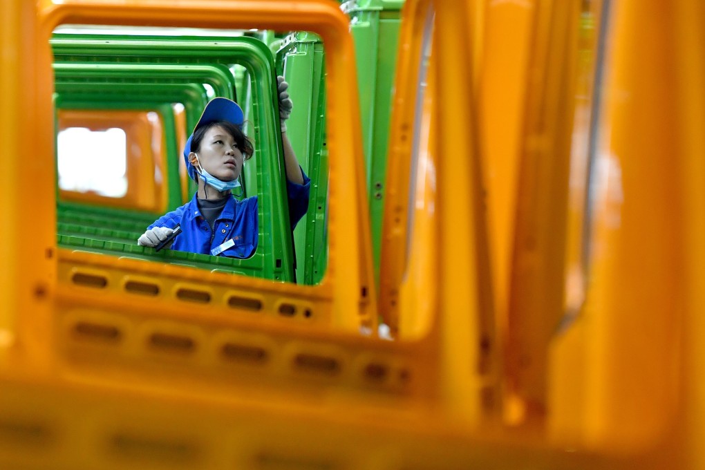 A worker is seen at a Shaanxi Automobile Holding Group factory in Xian, Shaanxi province, on November 2. The group produced 198,000 vehicles from January to October, a 28.5 per cent rise compared with the same period last year. Photo: Xinhua