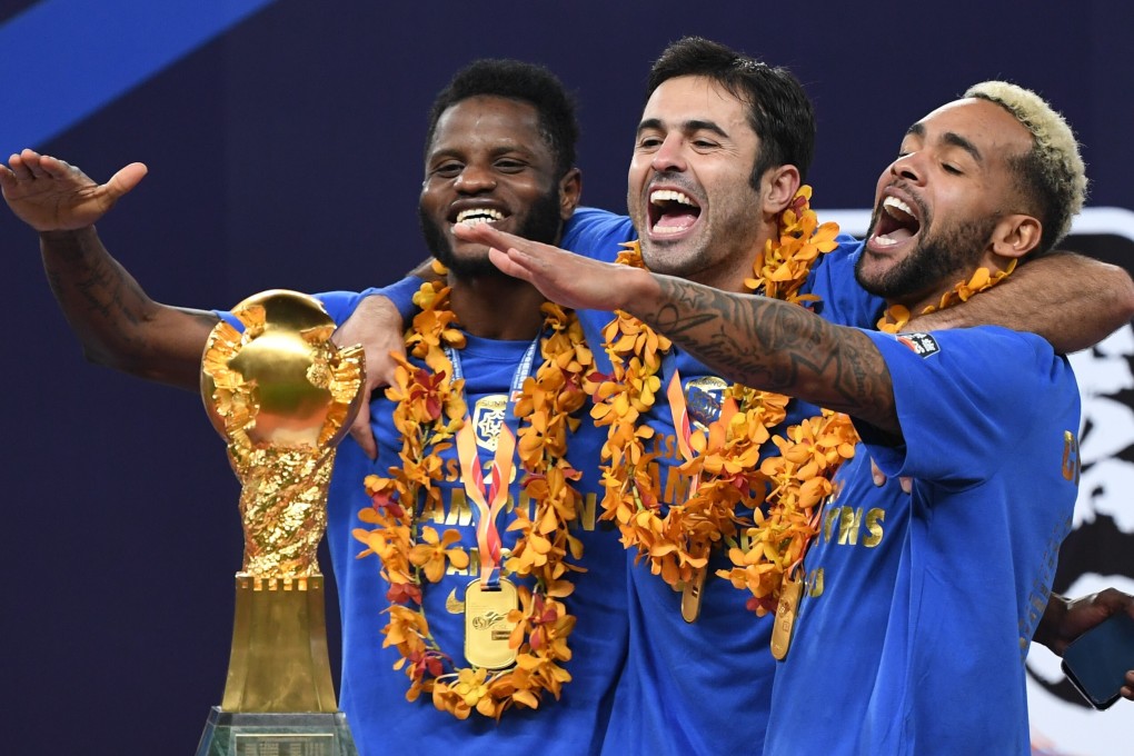 Jiangsu Suning players celebrate with the Chinese Super League trophy after winning the 2020 title. The club is one of many who will need to change their name to drop their corporate sponsor. Photo: Xinhua