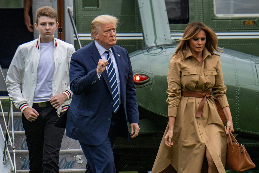 US President Donald Trump returns to the White House with first lady Melania Trump and their son Barron after a weekend in Bedminster. File photo: AFP