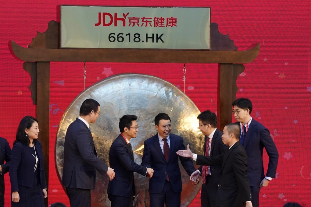 JD Health’s Xin Lijun, centre, during listing ceremony at headquarters in Beijing on December 8. Photo: AP