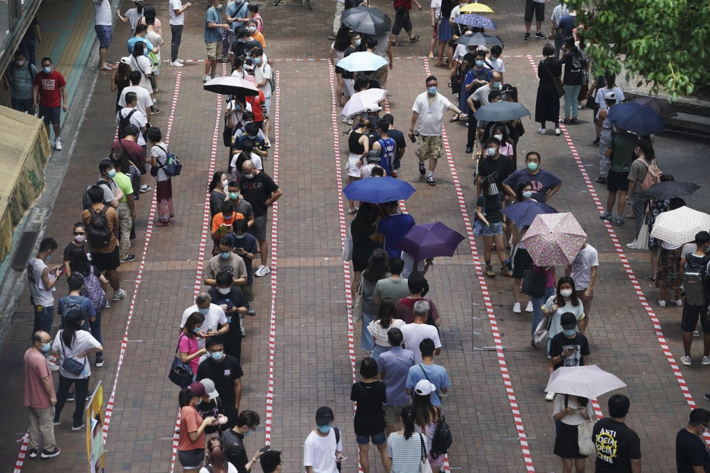 Hongkongers queue up to vote at a polling station in Tai Po on June 12 as part of the pan-democrat camp’s primary election to select candidates for the Legislative Council elections. The government later postponed the elections, citing the pandemic. An NPC Standing Committee decision leading to the disqualification of four lawmakers has called into question the fate of Hong Kong’s pro-democracy camp. Photo: Felix Wong