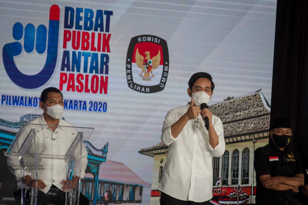 Mayoral candidate Gibran Rakabuming, the eldest son of President Joko Widodo, speaks alongside his running mate Teguh Prakosa during an election debate for mayor and deputy mayor in Solo on November 6. Photo: Reuters