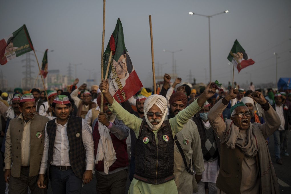 Indian farmers block a major highway during a protest against new farm laws at the Delhi-Uttar Pradesh state border. Photo: AP