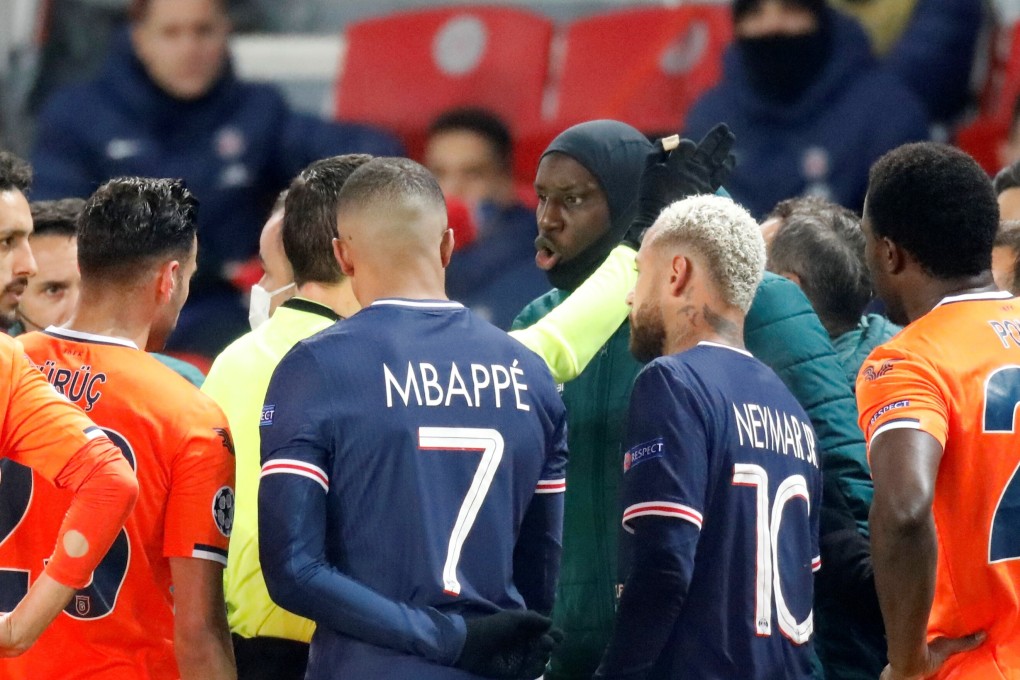 Istanbul Basaksehir’s Demba Ba talks to referee Ovidiu Hategan as Neymar and Kylian Mbappe watch on. Photo: Reuters