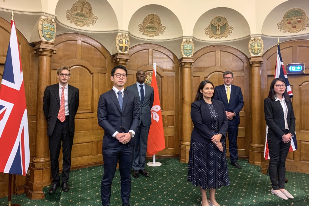 Hong Kong activists Nathan Law (front left) and Beatrice Li (front right) with British Home Secretary Priti Patel (centre). Photo: Handout