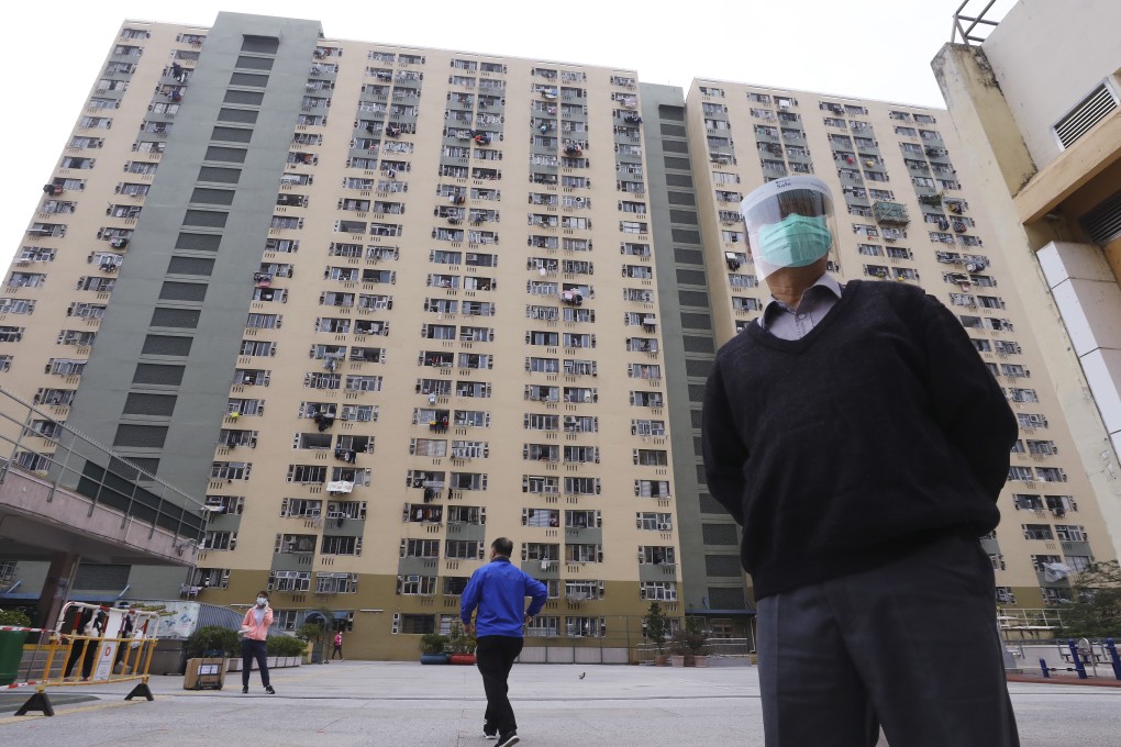 A staff of Community Testing Center wearing protective masks standing outside at Community Testing Center at Kwai Shing West Estate in Kwai Chung. More coronavirus patients were confirmed at Kwai Shing West Estate on Sunday. They all live in five flats on the same floor in block eight. 09DEC20 SCMP / Dickson Lee