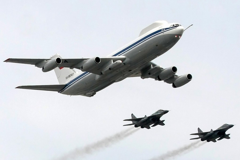 A Russian Ilyushin Il-80 plane and fighter jets fly near Red Square during the 2010 Victory Day parade rehearsal in Moscow. File photo: AFP