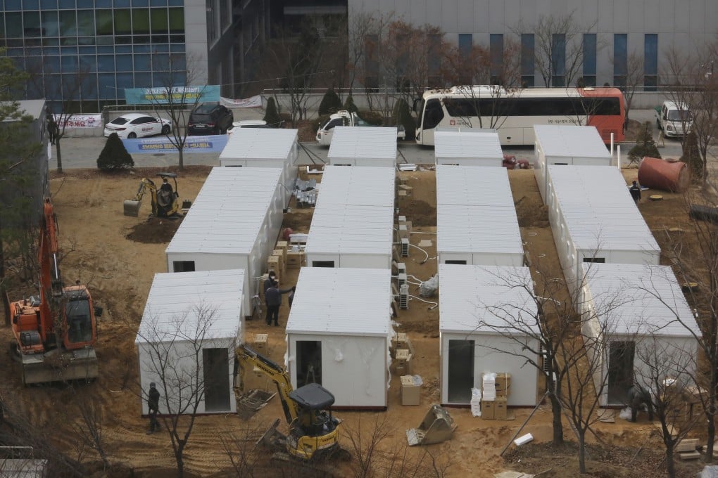 Workers put in place a temporary hospital ward made of shipping containers outside the Seoul Medical Centre on Thursday. Photo: AP