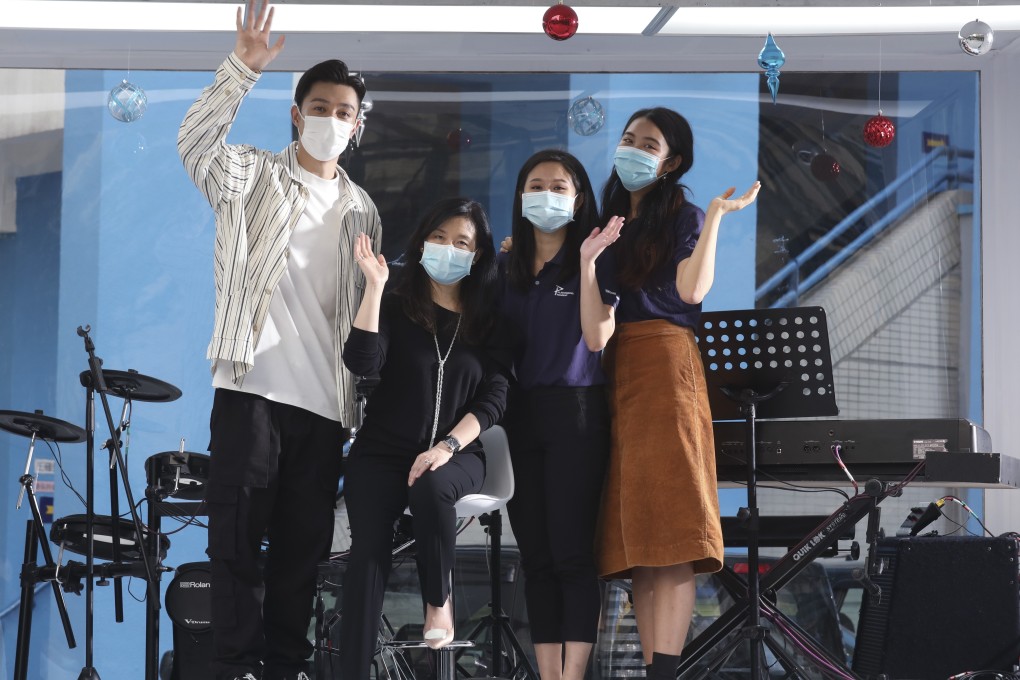 (From left) Operation Santa Claus ambassador Pakho Chau, general manager of public affairs at Swire Properties May Lam-Kobayashi, and students Kristy Yeung and Crystal Lam at Taikoo Primary School in Tai Koo. Photo: Xiaomei Chen