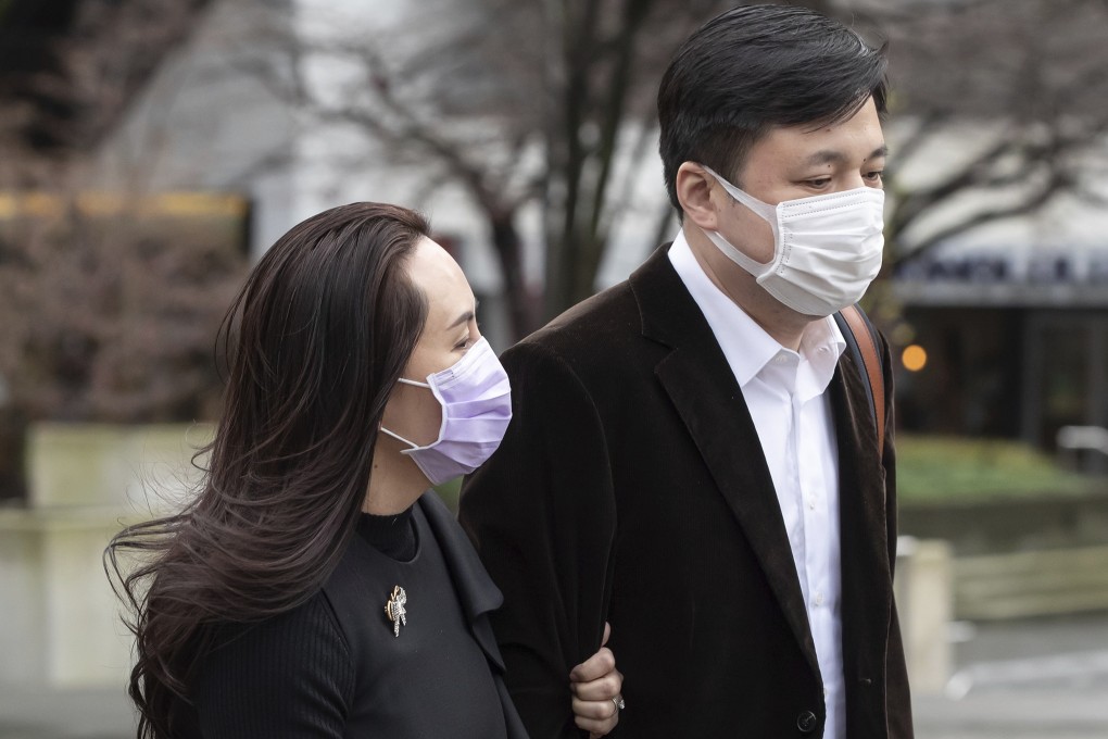 Meng Wanzhou, chief financial officer of Huawei, returns to BC Supreme Court with her husband, Liu Xiaozong, after a break from her hearing on Wednesday. Photo: The Canadian Press via AP