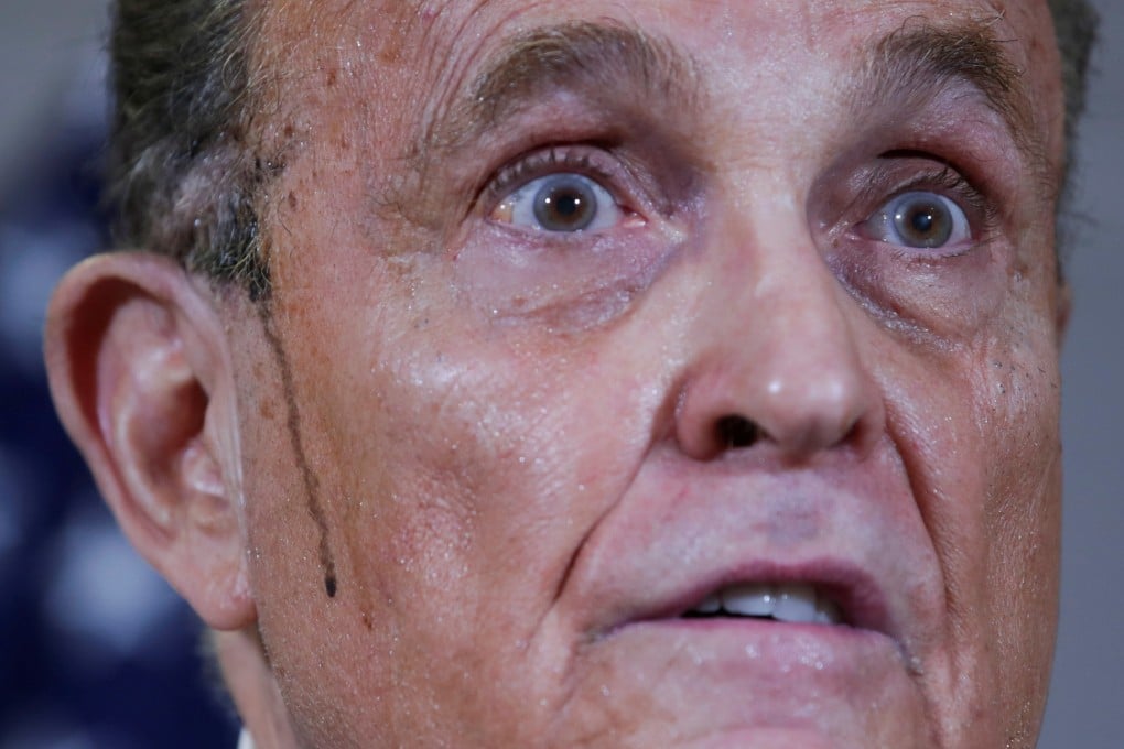 Sweat runs down Rudy Giuliani’s face at a news conference in November. File photo: Reuters
