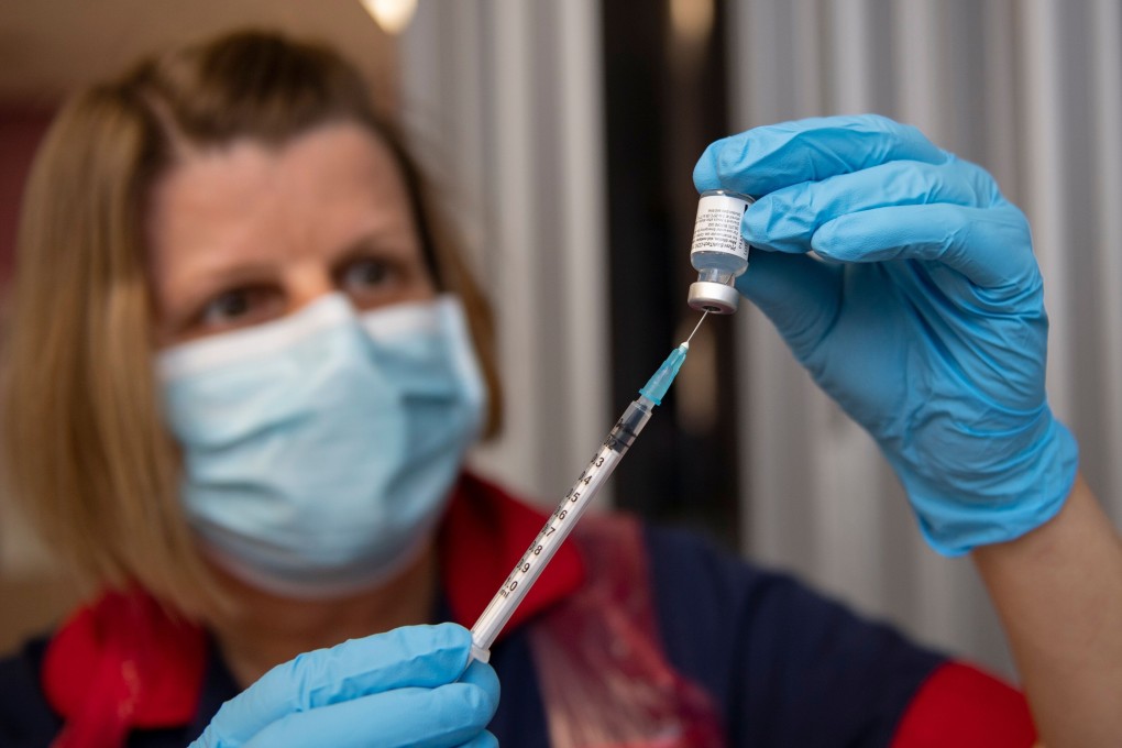 A nurse prepares a dose of the Pfizer-BioNTech Covid-19 vaccine at the Northern General Hospital in Sheffield, UK, on December 8. Photo: AFP