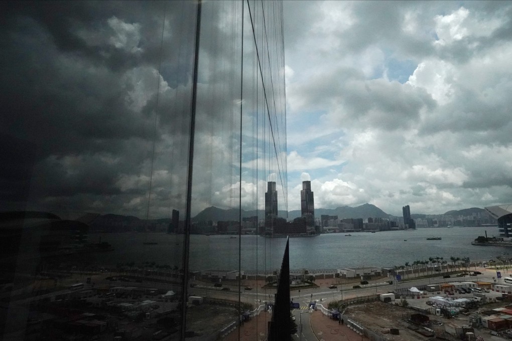 The Kowloon skyline is reflected in windows of the Legislative Council Complex. A newly founded political party is calling for “one country, two systems” to be extended for 50 years. Photo: Felix Wong