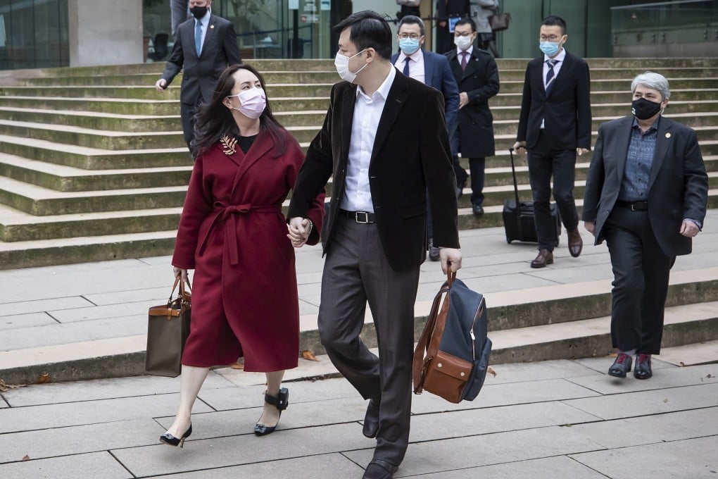 Meng Wanzhou leaves the Supreme Court of British Columbia with her husband, Liu Xiaozong, during a break from a hearing in Vancouver on Thursday. Photo: AP