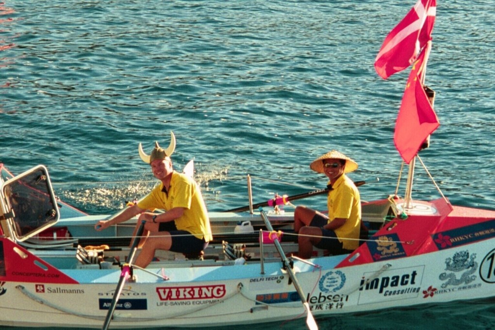 Sun Haibin and Christian Havrehed, with their boat Yantu, preparing to row the Atlantic and show their culture with traditional Chinese and Danish hats. Photo: SCMP