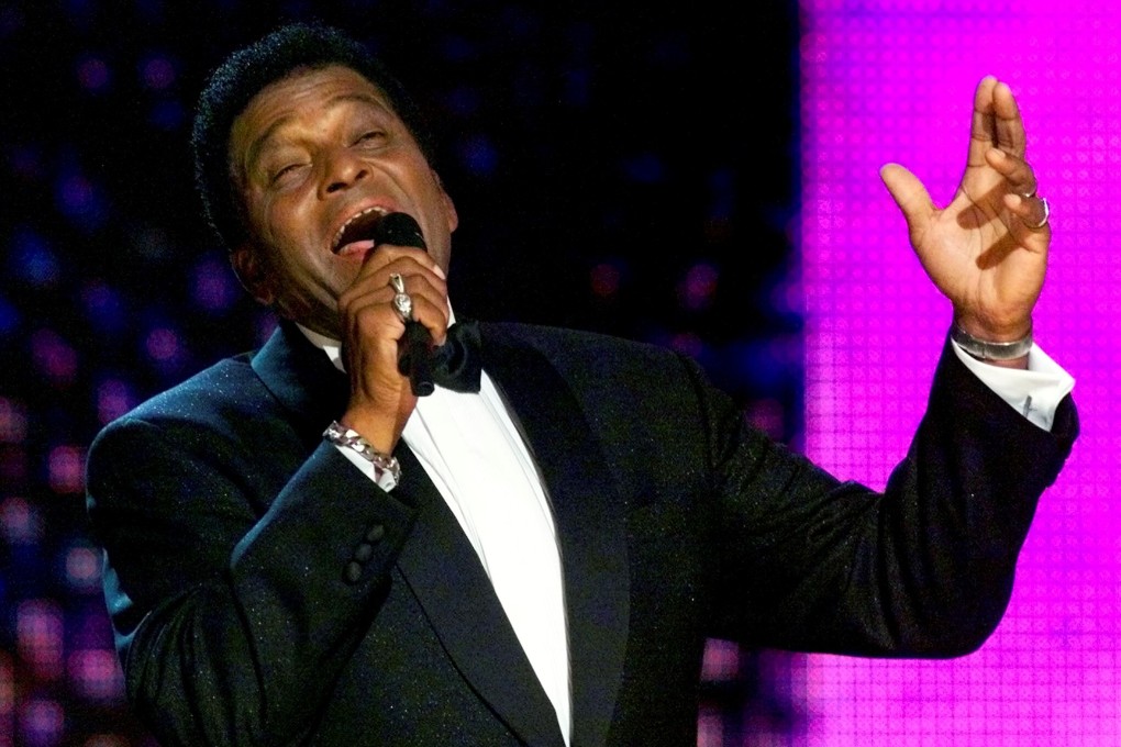 Country music signer Charley Pride performs at the Grand Ole Opry House in Nashville, Tennessee in 2000.