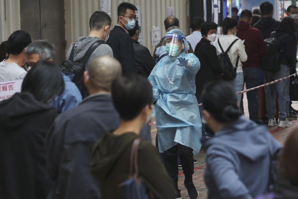 People queue up for Covid-19 testing at a community centre in Yau Ma Tei, on December 12, as the fourth wave of the pandemic continues to surge in Hong Kong. Photo: Xiaomei Chen