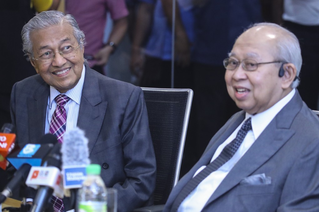 Mahathir Mohamad, left, with Razaleigh Hamzah of the United Malays National Organisation at their joint press conference on Monday. Photo: EPA