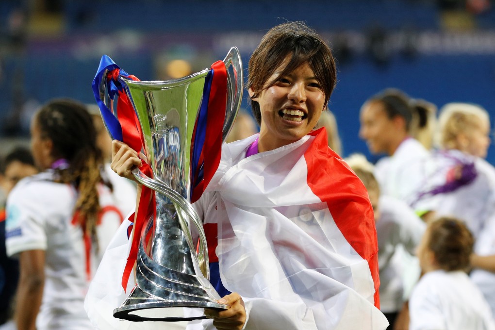 Lyon's Saki Kumagai celebrates with the trophy after winning the Uefa Women's Champions League. Photo: Reuters