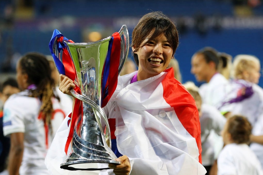 Lyon's Saki Kumagai celebrates with the trophy after winning the Uefa Women's Champions League. Photo: Reuters