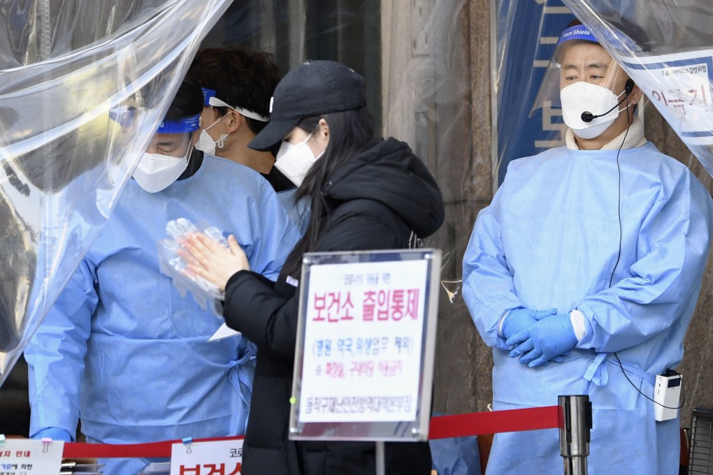 A woman arrives at a health care centre in Seoul to take a coronavirus test, as South Korea battles a fresh outbreak in cases. Photo: Kyodo