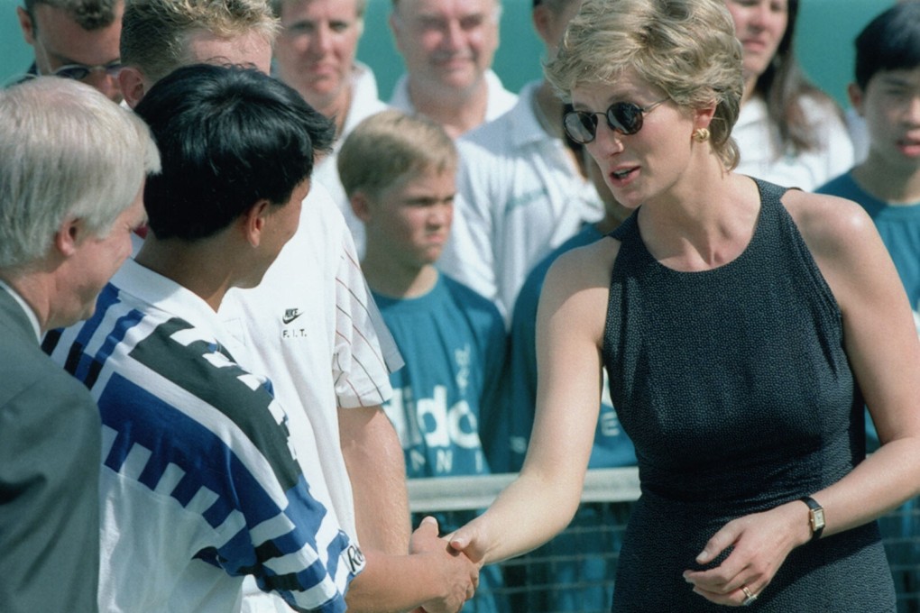 Princess Diana shakes hands with Michael Chang after his victory in the Salem Hong Kong Open tennis tournament at Victoria Park, Tin Hau, in April, 1995. She is wearing a pair of gold earrings from jewellers K.S. Sze and Sons, which she bought on her previous visit to Hong Kong in 1989. Photo: SCMP