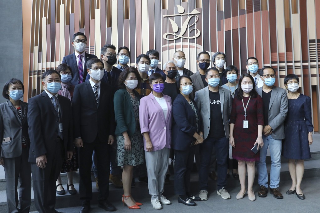 Former pan-democracy lawmakers pose for group photo with staff of the Legislative Council Secretariat as the Democrats bid farewell to the Legislative Council following their en masse resignation. Photo: Dickson Lee